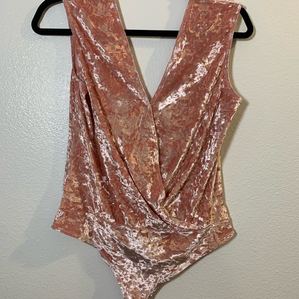 Velvet pink body suit.